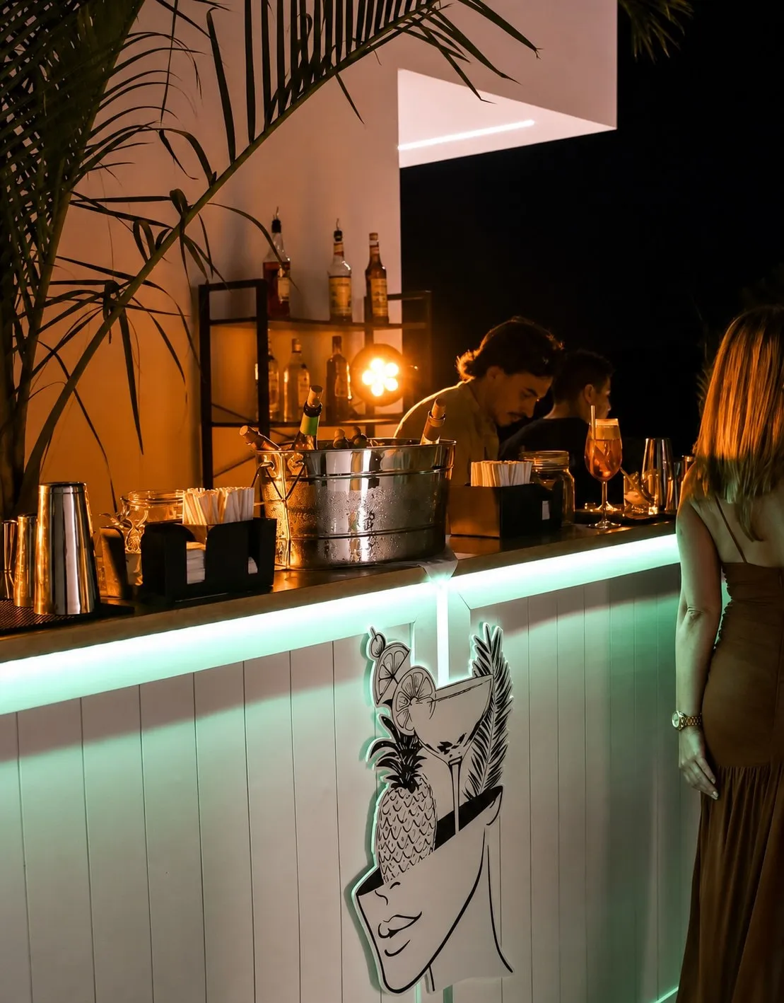 A guest served at the Kibou bar during an evening event